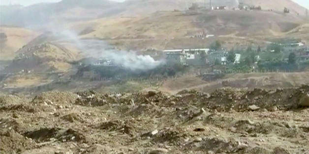 Smoke rises from buildings at the site of a car bomb explosion at a police headquarters in Cizre, located in Turkey's Sirnak province bordering both Syria and Iraq, in this still image from video August 26, 2016. REUTERS/via Reuters TV TPX IMAGES OF THE DAY
