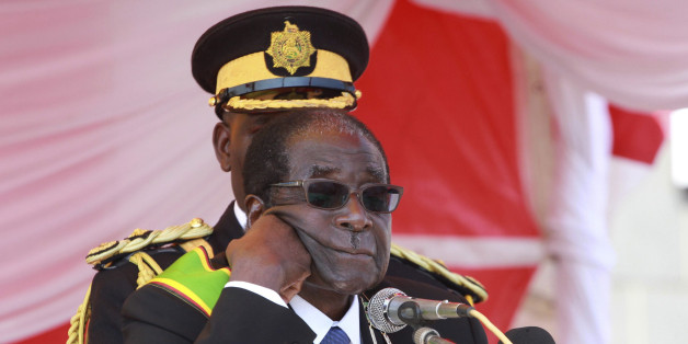 Zimbabwe's President Robert Mugabe addresses supporters at a Heroes Day rally in the capital Harare, August 8, 2011. Mugabe said on Monday Zimbabwe would punish firms from Western states who have slapped sanctions on senior officials in his ZANU-PF party, warning that global miners including Rio Tinto could be hit. REUTERS/Philimon Bulawayo (ZIMBABWE - Tags: POLITICS CIVIL UNREST)