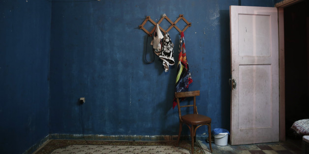 A view of an apartment which is occupied by immigrants at the "Prosfygika" complex in Athens November 1, 2013. It has been shelled, threatened with demolition and became such an eyesore that it was covered by a massive sheet during the 2004 Athens Olympics, but the historic 1930s housing complex built for Greeks fleeing Turkey is a hive of activity again. As Greece's six-year economic slump has increased the number of homeless to 20,000 in Athens alone, NGOs estimate, the "Prosfygika" complex has become a haven for squatters and drug addicts as well as immigrants from Iran and elsewhere trying to cross into northern Europe through Greece's porous borders. Picture taken November 1, 2013. REUTERS/Yorgos Karahalis (GREECE - Tags: SOCIETY POVERTY IMMIGRATION)