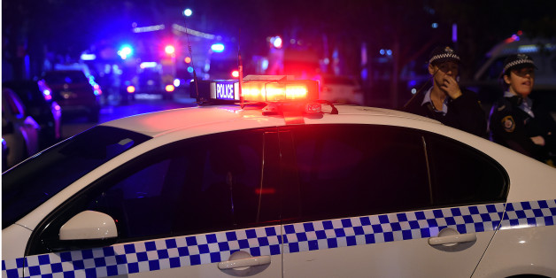 Police corden off the area around a police station in the Merrylands neighbourhood area of Sydney on July 21, 2016.
A man was arrested in Sydney on July 21 and a bomb disposal squad was examining his car after he drove it into an underground police station car park. / AFP / SAEED KHAN (Photo credit should read SAEED KHAN/AFP/Getty Images)