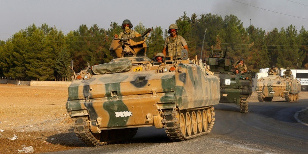 Turkish armoured personnel carriers drive towards the border in Karkamis on the Turkish-Syrian border in the southeastern Gaziantep province, Turkey, August 27, 2016. REUTERS/Umit Bektas