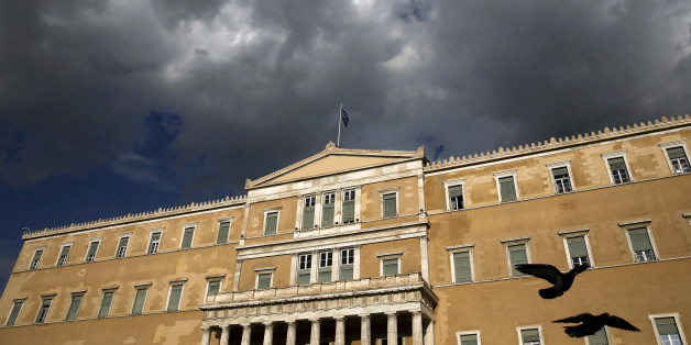 A Greek national flag flutters atop the parliament building in Athens, Greece April 11, 2016. REUTERS/Alkis Konstantinidis/File Photo