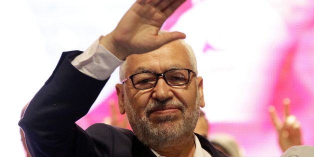 Rached Ghannouchi, leader of Tunisia's main Islamist Ennahda party, waves while arriving for campaign event at Habib Bourguiba Avenue in Tunis October 24, 2014. Tunisia will hold parliamentary elections on October 26 and a presidential election in November. Picture taken October 24, 2014. REUTERS/Anis Mili (TUNISIA - Tags: POLITICS ELECTIONS)