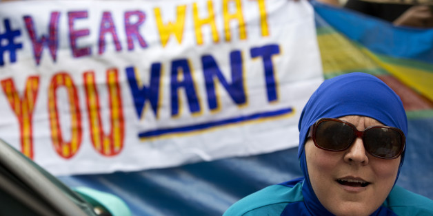 A woman wearing a 'Burkini' joins a protest outside the French Embassy in London on August 25, 2016, during a 'Wear what you want beach party' to demonstrate against the ban on Burkinis on French beaches and to show solidarity with Muslim women.French Interior Minister Bernard Cazeneuve warned Wednesday against stigmatising Muslims, as a furore over the banning of burkinis grew with the emergence of pictures showing police surrounding a veiled woman on a beach. Dozens of French towns and villag