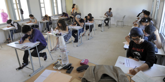 Tunisian students take the baccalaureat (high school graduation exam) exam on June 6, 2012 in Tunis. Some 129 181 candidates registered for the main session of the baccalaureat held this year from June 6 to 13. The average female candidates stood at 57.06% against 42% for boys. The Bachelor 2012 will be marked by the application of an adult aged 64 years and five students who are serving a prison sentence. The exam results will be announced on June 23, 2012. AFP PHOTO / FETHI BELAID (Photo credit should read FETHI BELAID/AFP/GettyImages)