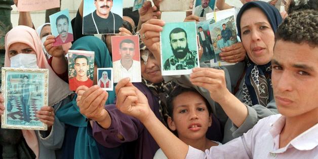 ALGIERS, ALGERIA: Families of missing victims of terrorism in Algeria hold a weekly demonstration at the National Office of Human Rights 02 September at Addis Ababa Square, showing photos of their relatives who have disappeared in the continuing Algerian civil war. (Photo credit should read STR/AFP/Getty Images)