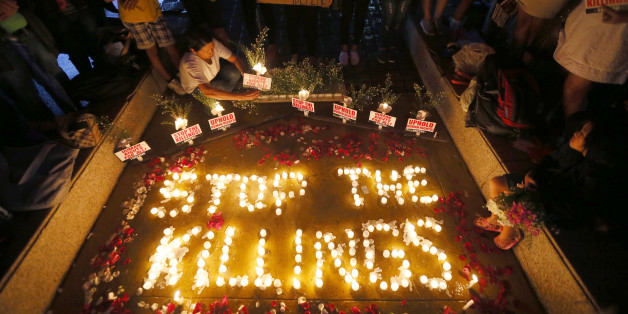 Human rights activists light candles for the victims of extra-judicial killings around the country in the wake of "War on Drugs" campaign by Philippine President Rodrigo Duterte Monday, Aug. 15, 2016 in suburban Quezon city, northeast of Manila, Philippines. The "war on drugs" campaign, which saw hundreds of mostly poor victims, has been condemned by human rights groups including the United Nations Chief Ban Ki-moon. (AP Photo/Bullit Marquez)