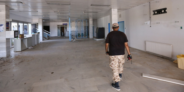 A picture shows on August 15, 2016 a Libyan fighter walking at the Ibn Sina Hospital in Sirte, east of the Libyan capital Tripoli, after forces loyal to Libya's UN-backed Government of National Accord (GNA) seized it from Islamic State group (IS) jihadists.
Libyan pro-government forces pressed an advance against the Islamic State group in the coastal city of Sirte as they battled jihadists holed up in waterfront residential areas.
/ AFP / MAHMUD TURKIA (Photo credit should read MAHMUD TURKIA/AFP/Getty Images)