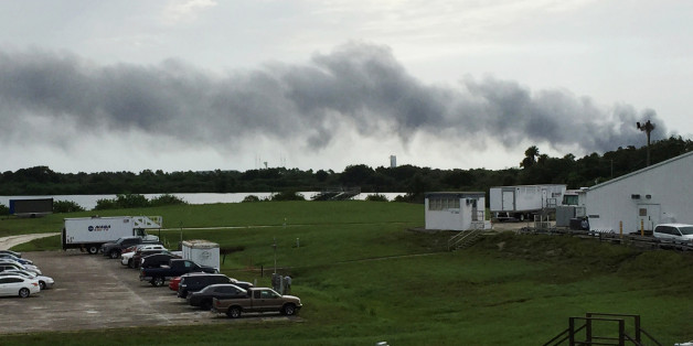 Smoke rises from a SpaceX launch site Thursday, Sept. 1, 2016, at Cape Canaveral, Fla. NASA said SpaceX was conducting a test firing of its unmanned rocket when a blast occurred. (AP Photo/Marcia Dunn)