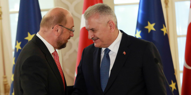 President of the European Parliament Martin Schulz (L) shakes hands wiyj Turkish Prime Minister Binali Yildirim (R) during a joint press conference on September 1, 2016 at the Cankaya Palace in Ankara.
Turkish Prime Minister Binali Yildirim on September 1, 2016 insisted his country would not relax its contested anti-terror laws, a key condition laid down by the European Union for giving Turks visa-free access to the bloc. Yildirim pointed to the series of terror attacks that have rocked Turkey in the past year in telling visiting EU Parliament chief Martin Schulz the government would maintain its hardline stance.
/ AFP / ADEM ALTAN (Photo credit should read ADEM ALTAN/AFP/Getty Images)