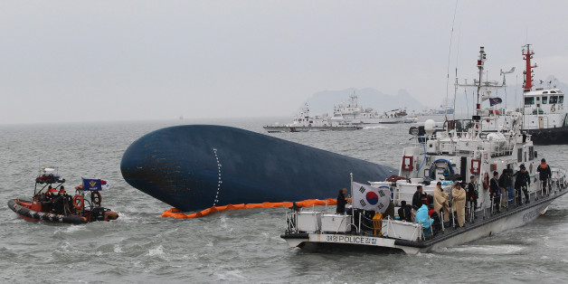 FILE - In this April 17, 2014 file photo, South Korean Coast Guard personnel search for missing passengers aboard the sunken South Korean ferry Sewol in the water off the southern coast near Jindo, South Korea. High school student Cho Eun-hwa, 16, was one of 304 people killed one year ago on Thursday, April 16 in the sinking of the ferry, and among nine whose bodies still have not been recovered. (AP Photo/Ahn Young-joon, File)