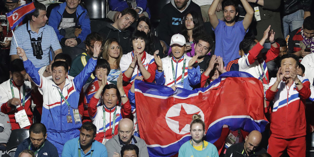 Spectators cheer for Kim Song I, of North Korea, as she plays against Ai Fukuhara, of Japan, during the women's singles table tennis bronze medal match at the 2016 Summer Olympics in Rio de Janeiro, Brazil, Wednesday, Aug. 10, 2016. (AP Photo/David Goldman)
