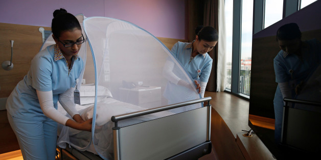 Nurses set up a mosquito tent, as part of a precautionary protocol for patients who are infected by Zika, to show the media at Farrer Park Hospital in Singapore September 2, 2016. REUTERS/Edgar Su