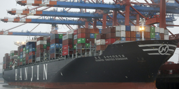 The 'United Kingdom' vessel of the Hanjin shipping company is stevedored at the harbour in Hamburg, Germany, Wednesday, Oct. 29, 2014. (AP Photo/Michael Sohn)