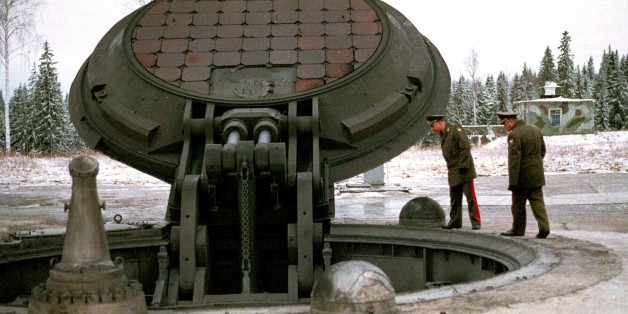 Russian military officials, no names given, look into an open silo of an intercontinental ballistic Topol-M missile at an undisclosed location in Russia in this 2001 photo. Russia has deployed a fresh batch of its top-of-the-line strategic nuclear missiles after a break caused by a funding shortage, said military officials on Monday, Dec. 22, 2003. (AP Photo)