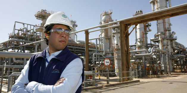 ALGERIA - DECEMBER 14: Employee Sofian Benyamina pauses at work at the In Salah Gas (ISG) Krechba Project, run by Sonatrach, British Petroleum (BP), and StatoilHydro, in the Sahara desert near In Salah, Algeria, on Sunday, Dec. 14, 2008. From produced gas, the carbon capture plant, the largest and first of its kind, removes annually the carbon dioxide emissions equivalent of 200,000 automobiles running 30,000 kilometers. The CO2 is then reinjected into a two-kilometer deep reservoir instead of