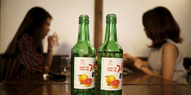 Bottles of fruit flavoured and low-alcohol soju are seen in this picture illustration at a pub in Seoul, South Korea, September 9, 2015. Professional women are driving a change in the way beverage companies look at South Korea, which hard-drinking men have made Asia's biggest alcohol consuming country on a per capita basis. As more women join the workforce in South Korea, a growing share of younger women are becoming regular drinkers, shifting consumption patterns in a male-dominated society where post-work drinking sessions are a staple of office life. Rising incomes and a greater interest in health also mean fewer Koreans merely seek out the cheapest way to get drunk. Picture taken September 9, 2015. REUTERS/Kim Hong-Ji