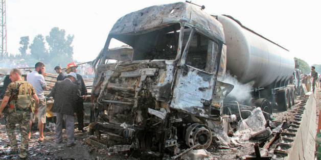 Syrian army soldiers inspect the damage at the site of two explosions that hit the Arzouna bridge area at the entrance to Tartous, Syria in this handout picture provided by SANA on September 5, 2016. SANA/Handout via REUTERS ATTENTION EDITORS - THIS PICTURE WAS PROVIDED BY A THIRD PARTY. REUTERS IS UNABLE TO INDEPENDENTLY VERIFY THE AUTHENTICITY, CONTENT, LOCATION OR DATE OF THIS IMAGE. FOR EDITORIAL USE ONLY. THIS PICTURE WAS PROCESSED BY REUTERS TO ENHANCE QUALITY. AN UNPROCESSED VERSION HAS