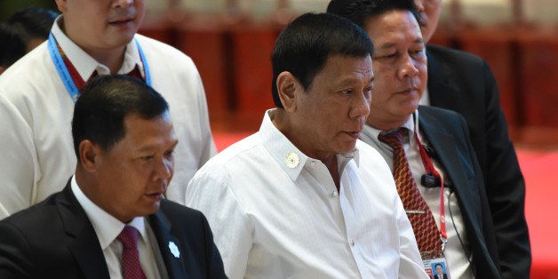 Philippine President Rodrigo Duterte (C) arrives at the convention centre to attend the 28th and 29th Association of Southeast Asian Nations (ASEAN)in Vientiane on September 6, 2016.Duterte expressed regret for a tirade against Barack Obama in which he called the US leader a 'son of a whore'. / AFP / ROSLAN RAHMAN (Photo credit should read ROSLAN RAHMAN/AFP/Getty Images)