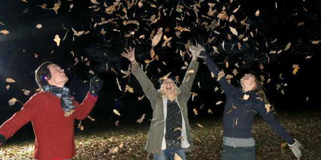 Kids playing in leaves