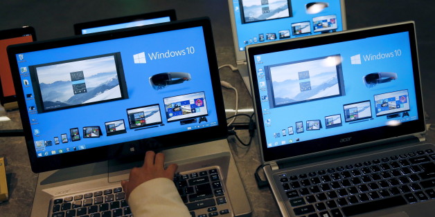A reporter tries Windows 10 installed laptop computer at Microsoft China Center One during a media tour in Beijing April 14, 2015. The center which has various showcases provides an innovation platform showcasing Microsoft inspired innovation in China, the company said.REUTERS/Kim Kyung-Hoon