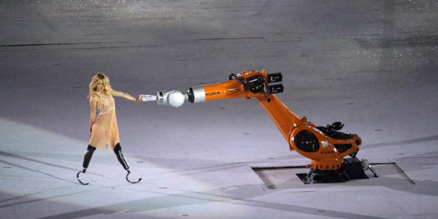 2016 Rio Paralympics - Opening ceremony - Maracana - Rio de Janeiro, Brazil - 07/09/2016. A performer interacts with a robotic arm during the opening ceremony.