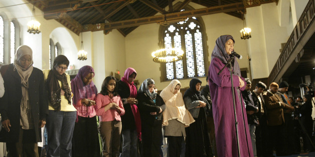 Amina Wadud, a professor of Islamic studies at Virginia Commonwealth University, right, leads prayer in New York Friday, March 18, 2005. Wadud lead a mixed-gender Muslim service Friday at Synod House at the Cathedral of St. John the Divine, an Anglican church in Manhattan, New York. (AP Photo/Gregory Bull)