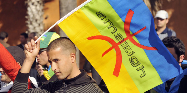 A local Amazigh Berber man waves a Berber flag as he attends a rally calling for the release of political prisoners and demanding more rights, in Rabat on February 3, 2013. REUTERS/Stringer (MOROCCO - Tags: POLITICS CIVIL UNREST SOCIETY)