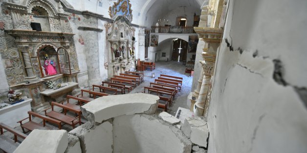 View of the damage caused by an earthquake in the church of Yanque, Cailloma province, Peru, on August 16, 2016. A moderate 5.3-magnitude earthquake in Peru killed at least four people including a US tourist and left 68 injured, crushing villagers under rubble and blocking roads, officials said Monday. / AFP / STR (Photo credit should read STR/AFP/Getty Images)