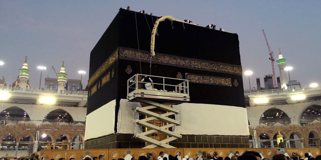 Saudi workers change the Kiswah (the cloth that covers the Kaaba) in Mecca, Saudi Arabia, Sunday, Sept. 11, 2016. Workers change the Kiswah once a year when pilgrims leave for the plains of Mount Arafat during the Hajj. (AP Photo/ Hussein Malla)