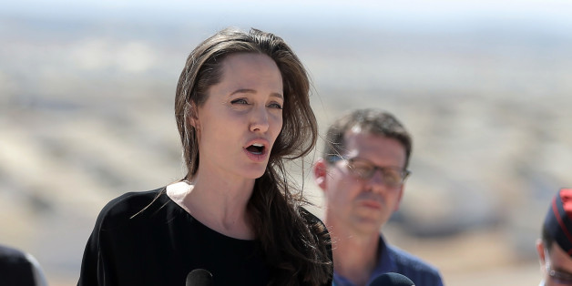 Actress and UN refugee agency envoy special envoy Angelina Jolie talks during a visit to a Syrian refugee camp in Azraq in northern Jordan on Friday, Sept. 9, 2016. She is calling on the international community to end the protracted Syrian civil war and increase support for refugees across the region. Five years into the Syrian conflict, she said brutal violence rages while the UN Security Council remains divided on a political solution. (AP Photo/Ahmad Alameen)