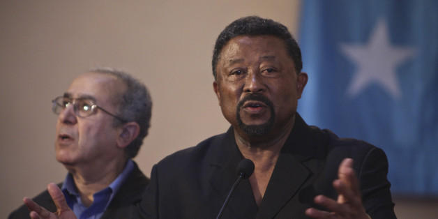 Jean Ping (R), chairman of the Commission of the African Union, speaks at a joint news conference with Somalia's President Sheikh Sharif Sheikh Ahmed (not pictured) at Villa Somalia, the complex that houses the Transitional Federal Government (TFG), in Mogadishu August 20, 2011. REUTERS/Stuart Price/AU-UN IST Photo/Handout (SOMALIA - Tags: POLITICS) FOR EDITORIAL USE ONLY. NOT FOR SALE FOR MARKETING OR ADVERTISING CAMPAIGNS. THIS IMAGE HAS BEEN SUPPLIED BY A THIRD PARTY. IT IS DISTRIBUTED, EXACT