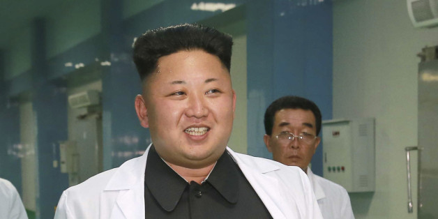 North Korean leader Kim Jung Un visits the newly commissioned Kalma Foodstuff Factory in this undated photo released by North Korea's Korean Central News Agency (KCNA) in Pyongyang August 15, 2014. REUTERS/KCNA (NORTH KOREA - Tags: POLITICS FOOD) ATTENTION EDITORS - THIS PICTURE WAS PROVIDED BY A THIRD PARTY. REUTERS IS UNABLE TO INDEPENDENTLY VERIFY THE AUTHENTICITY, CONTENT, LOCATION OR DATE OF THIS IMAGE. FOR EDITORIAL USE ONLY. NOT FOR SALE FOR MARKETING OR ADVERTISING CAMPAIGNS. THIS PICTUR