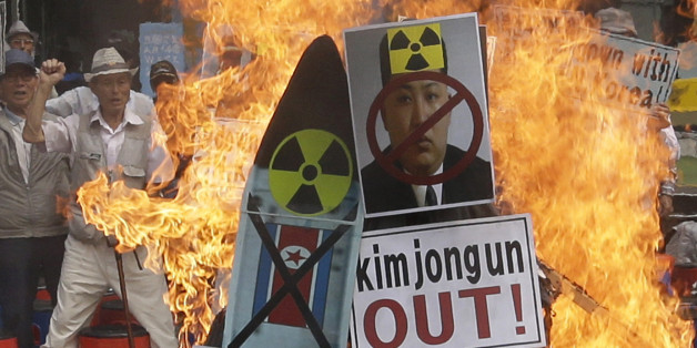A defaced image of North Korean leader Kim Jong Un is burned by South Korean protesters during a rally denouncing North Korea's latest nuclear test, in Seoul, South Korea, Saturday, Sept. 10, 2016. The U.N. Security Council is strongly condemning North Korea's latest nuclear test and says it will start discussions on "significant measures" against Pyongyang including new sanctions. (AP Photo/Ahn Young-joon)