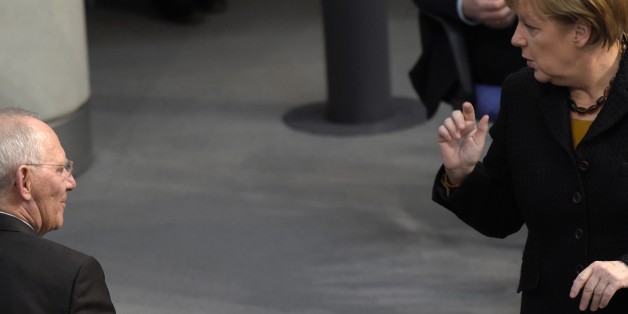German Chancellor Angela Merkel talks with German Finance Minister Wolfgang Schaeuble during a session of the Bundestag (lower house of parliament) in Berlin on December 16, 2015.
Ahead of the EU summit in Brussels, Merkel lays out Germany's positions on the European refugee crisis, jihadist threats and Britain's demands for EU reform in an address to parliament. / AFP / ODD ANDERSEN (Photo credit should read ODD ANDERSEN/AFP/Getty Images)