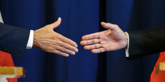 TOPSHOT - US Secretary of State John Kerry (L) and Russian Foreign Minister Sergei Lavrov shake hands at the end of a press conference closing meetings to discuss the Syrian crisis on September 9, 2016, in Geneva.The United State and Russia on Friday agreed a plan to impose a ceasefire in the Syrian civil war and lay the foundation of a peace process, US Secretary of State John Kerry said. / AFP / FABRICE COFFRINI (Photo credit should read FABRICE COFFRINI/AFP/Getty Images)