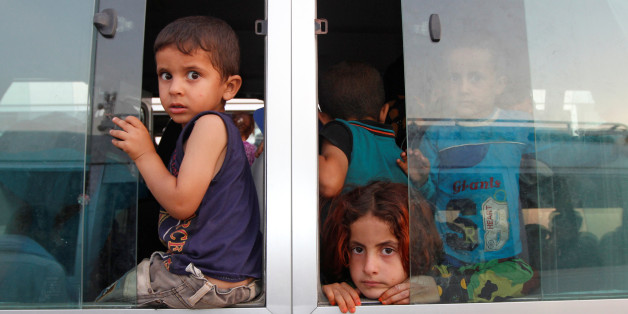 Displaced Iraqi children, who had fled to Syria to escape the violence in Mosul, transfer to a refugee camp in Kirkuk as they return to Iraq September 10, 2016. REUTERS/Ako Rasheed