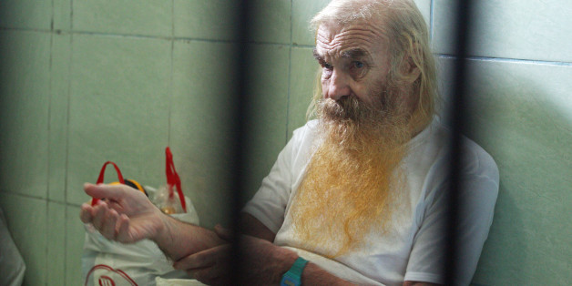 In this Monday, May 2, 2016, photo, Australian citizen Robert Andrew Fiddes Ellis sits in a cell at the prosecutors office in Bali, Indonesia. The trial of Ellis is underway on charges he sexually abused 16 girls on the tourist island of Bali in 2014 and 2015. (AP Photo/Firdia Lisnawati)