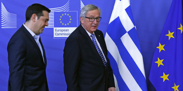 Greek Prime Minister Alexis Tsipras (L) is welcomed by European Commission President Jean-Claude Juncker (R) ahead of a meeting at the EU Commission headquarters in Brussels, Belgium February 17, 2016. REUTERS/Yves Herman