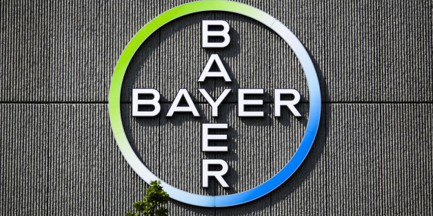 FILE - In this May 23, 2016, file picture the Bayer AG corporate logo is displayed on a building of the German drug and chemicals company in Berlin, Germany. German drug and farm chemical company Bayer AG said it has signed a deal Wednesday, Sept. 14, 2016, to acquire seed and weed-killer company Monsanto for about $66 billion in cash. (AP Photo/Markus Schreiber)