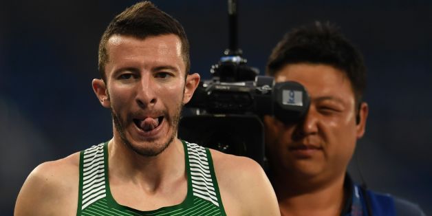 Algeria's Mohamed Fouad Hamoumou grimaces at the end of the Men's Heat 1 400M semifinal at the Olympic Stadium during the Rio 2016 Paralympic Games in Rio de Janeiro, Brazil, on September 13, 2016. / AFP / CHRISTOPHE SIMON (Photo credit should read CHRISTOPHE SIMON/AFP/Getty Images)