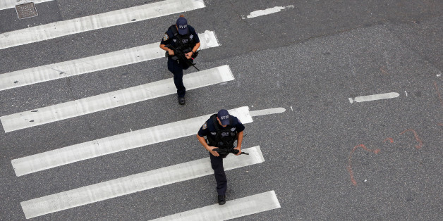 Police work at the scene where a man was shot by police in Manhattan, New York, U.S., September 15, 2016. REUTERS/Andrew Kelly