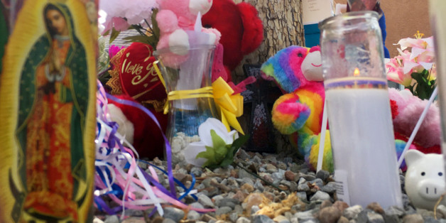 A memorial for a 10-year-old girl who police said was sexually assaulted, strangled then dismembered is seen at an Albuquerque, N.M., apartment building Thursday, Aug. 25, 2016. On the day the girl was going to celebrate her 10th birthday, she was found dead Wednesday in her family's apartment by Albuquerque police, her dismembered remains lying under a burning blanket. The girl's mother, 35-year-old Michelle Martens, her 31-year-old boyfriend, Fabian Gonzales, and his 31-year-old cousin, Jessica Kelley, are facing charges. (AP Photo/Russell Contreras)