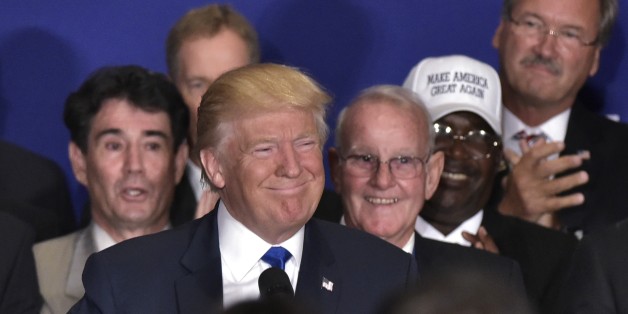 Republican presidential nominee Donald Trump smiles as he arrives on stage for a press conference with Medal of Honor recipients and veterans during a press conference at the Trump International Hotel, in Washington, DC on September 16, 2016. / AFP / MANDEL NGAN (Photo credit should read MANDEL NGAN/AFP/Getty Images)