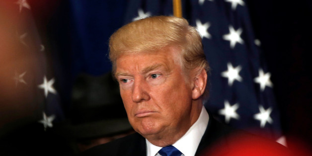 Republican presidential nominee Donald Trump reacts as reporters yell questions to him after he stated that he believes U.S. President Barack Obama was born in the United States at a campaign event at the Trump International Hotel in Washington, D.C., U.S., September 16, 2016. REUTERS/Mike Segar TPX IMAGES OF THE DAY
