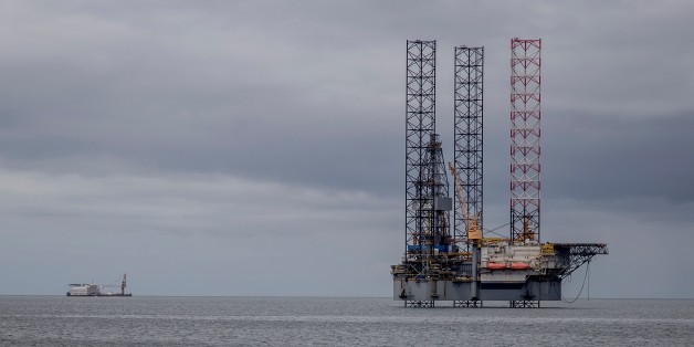 An off-shore oil rig is seen on August 22, 2016 off the coast of Port-Gentil.The drop in oil prices, which are currently languishing around $50 a barrel, has hit the city. The Gabon is the smallest producer of the Organization of the Petroleum Exporting Countries (OPEC) with 214,000 barrels a day in June 2016 but oil has made the fortune of Port-Gentil. / AFP / SAMIR TOUNSI (Photo credit should read SAMIR TOUNSI/AFP/Getty Images)