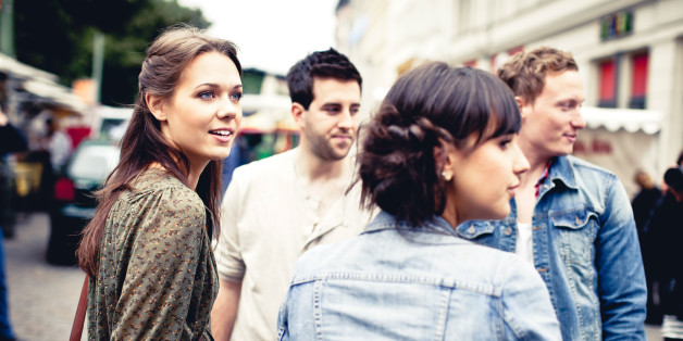 Four young adults in city