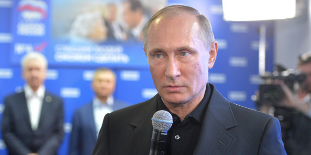 Russian President Vladimir Putin speaks at the United Party's election headquarters in Moscow, Russia, Sunday, Sept. 18, 2016. President Vladimir Putin, who formally is not a United Russia member, turned up at its election headquarters shortly after the first results were announced and congratulated the would-be lawmakers. (Alexei Druzhinin/Sputnik, Kremlin Pool Photo via AP)