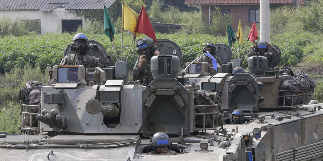 South Korean army soldiers ride their armored vehicles during an annual exercise in Paju, South Korea, near the border with North Korea, Sunday, Sept. 11, 2016. The U.N. Security Council is strongly condemning North Korea's latest nuclear test and says it will start discussions on "significant measures" against Pyongyang including new sanctions. (AP Photo/Ahn Young-joon)