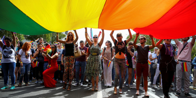 Participants hold a rainbow flag during an annual LGBT (Lesbian, Gay, Bisexual and Transgender) pride parade in Belgrade, Serbia September 18, 2016. REUTERS/Marko Djurica